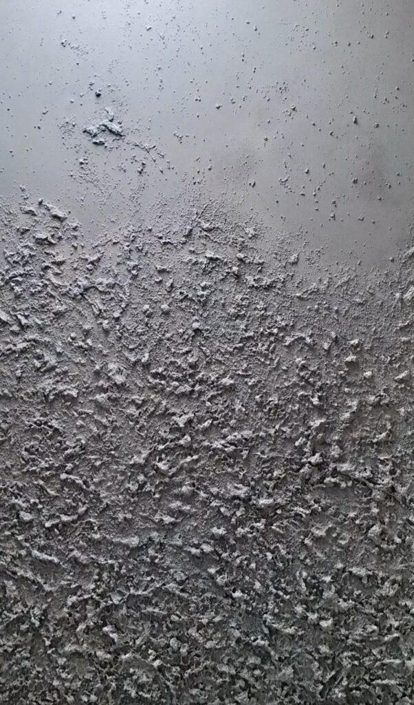 Close-up of textured acrylic painting in warm neutral tones for luxury interior design